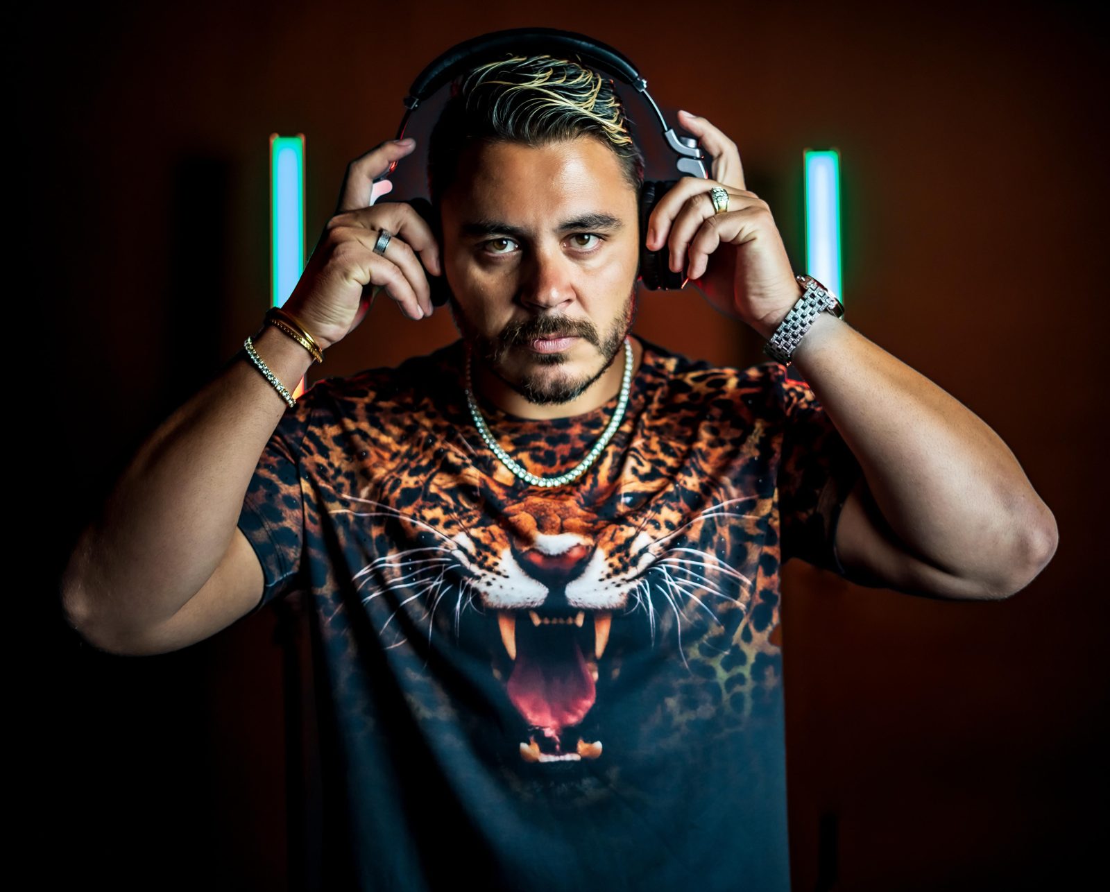 Studio portrait of Evan Halls in neon light
