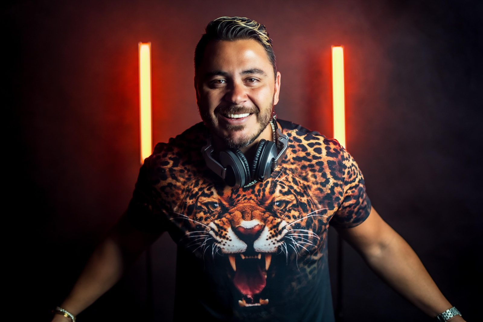 DJ Evan Halls press photo, red neon portrait